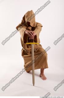 01 2018 01 JOEL ADAMSON MONK KNEELING POSE WITH SWORD